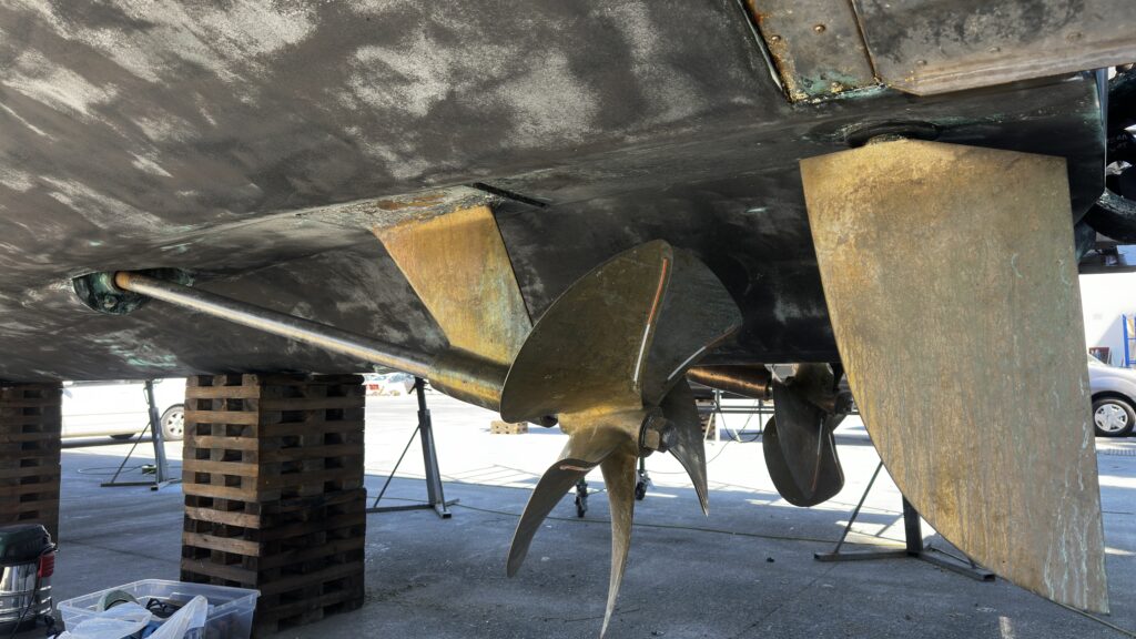 yacht propeller shaft and rudder exposed during scheduled haul-out